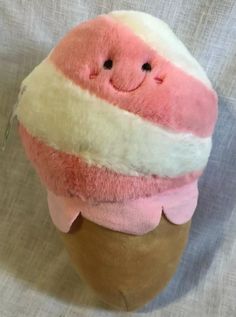 an ice cream cone with a smiling face on it