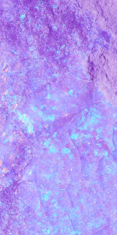 an abstract purple and blue background with small bubbles in the center, on top of some rocks