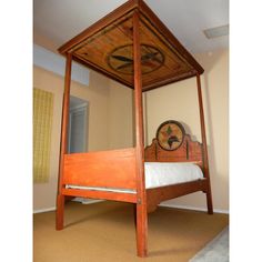 a wooden bed frame with a clock on the top