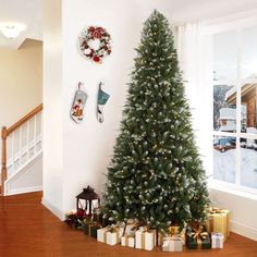 a decorated christmas tree in the corner of a room