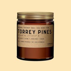 On a tan background is a brown glass jar candle with a neutral label that reads, Torrey Pines. Space Notes, Pine Candle, Sage Candle, Torrey Pines, Candle Sizes, Book Candle, Book Stationery, Glass Design, Kitchen Bar