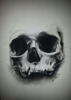 a black and white drawing of a skull