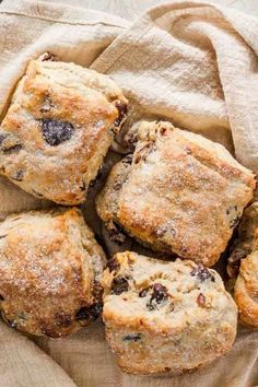 blueberry muffins are piled on top of each other