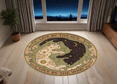 a living room with a rug that says live by the sun, love by the moon