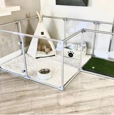 a dog house that is in the middle of a room with a cat bed inside