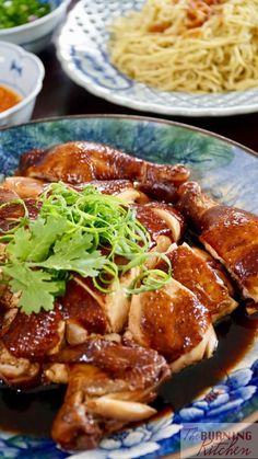 several plates of food on a table with chopsticks, sauce and noodles in them