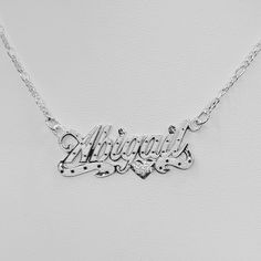 "-Abigail Handmade Item. -Style: Brush Finish -Jewelry Type: Nameplate Necklaces. -Material: Solid 925 Sterling Silver. -Color: Silver. -Pendant Bar Measured: 1.5\" Long x 0.50\" Wide -Thickness Nameplate .8mm. - Chain Style: Figaro. -Clasp: Lopters Claw. -Thickness Chain 1.5 mm -Necklace length available: (16\",18\",20\"22\"). -The pendant bar is included in necklaces length measurement, the necklaces are laid straight and measured end to end. - Nameplate Letters (Max 1 Capital, Max 9 letters). Silver Name Plate Necklace, Western Quince, Quince Jewelry, 14kt Gold Jewelry, Necklaces Length, Silver Name Necklace, Name Necklace Silver, Jewelry To Buy, Jewellery Marketing