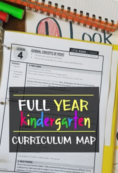 the full year kindergroten map is on top of a desk with school supplies