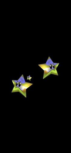 two star shaped objects on a black background