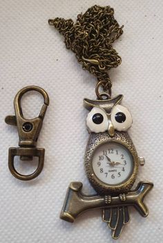 Pocket Watch necklace keyring Bronze Tone, Antique looking Analogue, battery included Comes with chain & keyring fob Bronze Antique Locket Necklace, Vintage Engraved Bronze Pocket Watch, Antique Bronze Engraved Pocket Watch, Steampunk Bronze Pocket Watch With Locket, Antique Bronze Pocket Watch With Locket, Pocket Watch Necklace, Vintage Owl, Analog Watch, Owl Bird