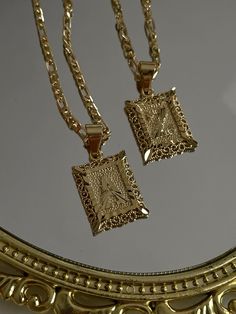 "Beautiful rectangle shape initial necklace! The details make this pendant really shine. DETAILS + MATERIALS  - 18k gold plated copper, slow to tarnish - measures 17\" long (no extension) lays perfectly in the middle of upper chest - perfect for layering JEWELRY CARE To help make all of your jewelry pieces last longer, please avoid wetting and exposure to harsh chemicals. Remove before showering to maintain care and shine. PACKAGING All of our jewelry comes in a pouch or box (for bigger orders) filled with rose petals and a clear quartz crystal.  Our beautiful packaging completes your Asiatic Moon experience by truly feeling like you purchased something for your self-care/love routine. It'll make you feel like you romanticized your life just a little bit more!  We also include a compliment Cambodian Jewelry, Bday List, Layering Jewelry, Rectangle Necklace, Gold Initial Necklace, Letter Pendant Necklace, Gold Name Necklace, Initial Necklace Gold, Classy Jewelry