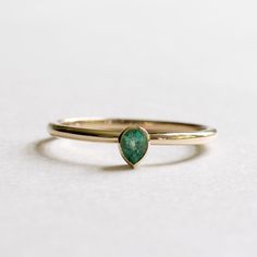 14k yellow gold natural petite emerald teardrop ring Metal: 14k yellow gold Stone: natural emerald Stone Size: 4mmx3mm Stone cut: Pear Stone Carat Weight: 0.17carat Dimension: Approx 1.5mm band. Emerald Teardrop Ring, Pear Emerald Ring, Gold Teardrop Emerald Ring, Fine Jewelry Emerald Teardrop Ring, Emerald Teardrop Ring Fine Jewelry, Teardrop Emerald Ring In Fine Jewelry Style, Green Teardrop 14k Gold Ring, Teardrop Emerald Ring In Yellow Gold, 14k Yellow Gold Pear-shaped Emerald Ring