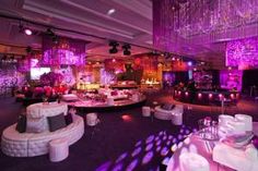 a banquet hall decorated in purple and white