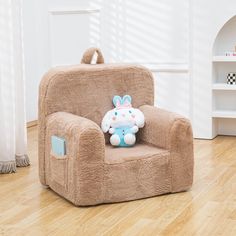 a brown chair with a stuffed animal on it