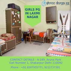 there are two beds in this room with the name girls pg in laxmi nagar