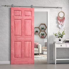 an open pink door in a white room