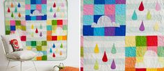 a colorful quilt hanging on the wall next to a white chair and window in a room