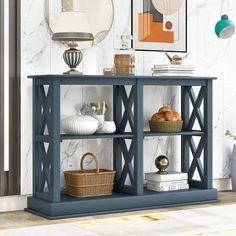 a blue bookcase with baskets on it in front of a marble wall and floor