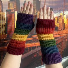 Rainbow arm warmers for you! Featuring 6 colors of acrylic yarns, this set of 2 arm warmers has been pre-washed by machine to ensure durability. Double layered, and designed with two thumb-holes so you can wear them however you like - no need for me to decide which direction the colors should go!  For additional wash care I recommend... Hand wash or machine wash in a laundry bag to avoid snags with zippers, buttons, velcro, etc. Cool/warm water Do not use bleach or dry clean Item may not be smoo Addi Knitting Machine, Rainbow Accessories, Fingerless Mitts, Very Hungry Caterpillar, Hot Iron, Thumb Holes, Yarn Art, Machine Knitting, Mitten Gloves