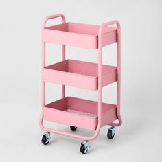 a pink plastic cart with three shelves on each side and two wheels, all in the same color