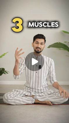 a man sitting on the floor with his hands in the air while talking to someone