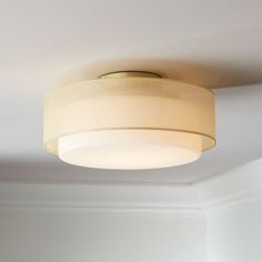 a light fixture in a room with white walls