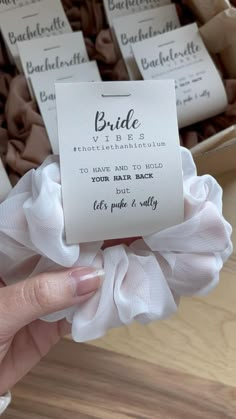 a person holding up a card with some sort of label on it that says bride