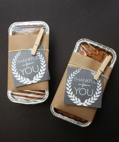 there are two small packages with food in them that say thank you and one is wrapped in brown paper