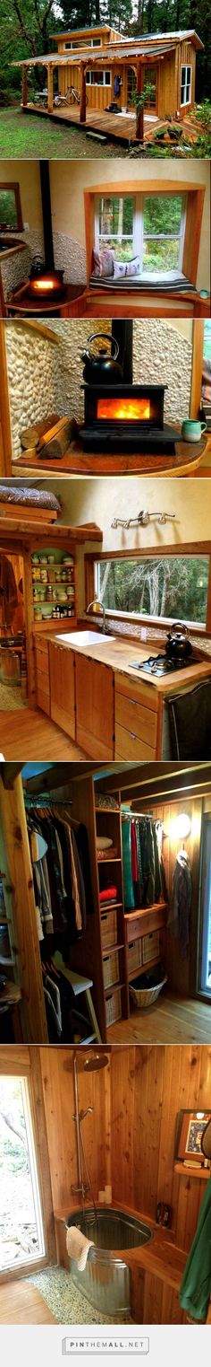 the inside of a tiny house with wood paneling and open storage compartments on each side