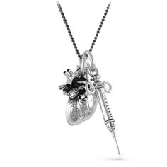 I made this Anatomical Heart and Syringe necklace and my world immediately went black and white. Buxom, corsetted wenches started sliding out of the shadows holding wooden bowls of musty apples and the slick cobbled streets echoed the shrieks of the crows in the darkness above. Heavy velvet, the color of blood, flashed in front of my eyes before running down the midnight alley, leaving a memory of cold steel and anguish in my nostrils. Gas lamps flicker and die. The night gets thicker, weightier