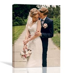 a bride and groom pose for a wedding photo