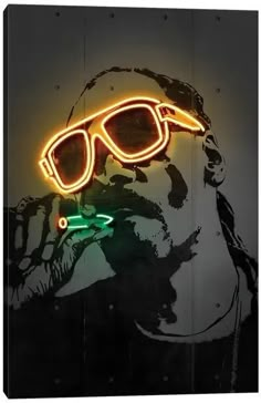 a neon sign with a man's head wearing sunglasses and a green light on it