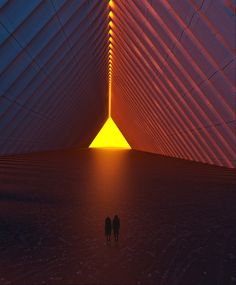 two people are standing in the middle of a room with an orange light at the end