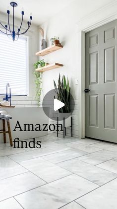 an image of a kitchen with white tile flooring and gray door handle on the right side