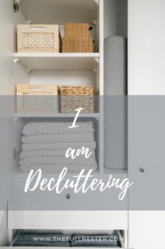 an open cabinet with towels and baskets on it in front of the words, i am decluttering