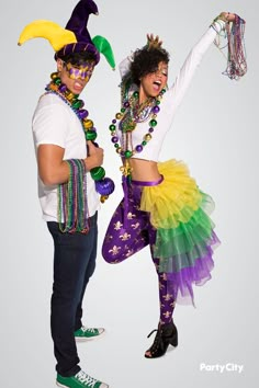 two people dressed up in costumes and headgear