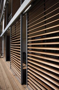 a wooden slatted wall on the outside of a building