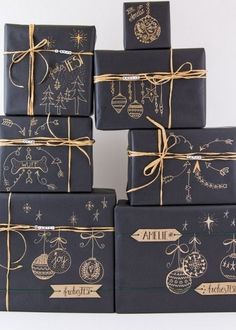 a stack of wrapped presents sitting on top of each other in front of a blue and white background