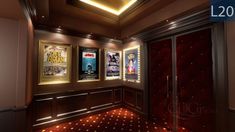 a movie theater with posters on the wall and lights in the ceiling, along with red carpeting