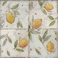 the tile is decorated with lemons and green leaves on it's sides,