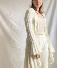 "Vintage super rare long knit cardigan in white colour No closure and tight the sleeves Condition: Quite good Composition: No label tag. But most possibly a wool blend Size: It will fit into EU/XSmall or 6-8 UK / 2-4 US sizes depending on the desired fit Please check the measurements.  Measurements :  Bust circumference: 80 cm (31.5\") Sleeve length: 71 cm (28\") Total length: 96 cm (38\") Model's size: 38 EU / 10 UK / 6 US (a bit tight) *Please concentrate on measurements, instead of size tags White Cozy Long Sleeve Cardigan, Cozy White Long Sleeve Cardigan, Long White Sweater Coat For Winter, Long White Winter Sweater Coat, White Long Winter Sweater Coat, White Long Cardigan For Winter, White Long Sleeve Soft Knit Sweater Coat, White Soft Knit Long Sleeve Sweater Coat, White Long Sleeve Cozy Sweater Coat