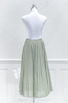 Perfect for your autumnal wardrobe, this breezy midi skirt in pleated sage green chiffon features a smocked elastic waistline and a-line silhouette made for twirling! . Details: S: Waist 26"-30", Length 32" M: Waist 28"-32", Length 32.5" L: Waist 30"-34", Length 33" Elastic Waistline Lined Material: 100% Polyester Care: Gentle Wash Cold / Hang Dry Imported Ships in 1 to 2 Business Days Free US Shipping on Orders over $100 Chiffon Midi Skirt, French Girl Style, Midi Skirts, French Girl, Pink Aesthetic, Skirt Top, Sweater Skirt, Bridal Style, Sage Green