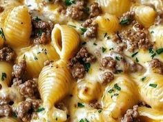 a close up view of some pasta with meat and cheese