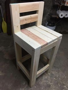 a wooden chair made out of pallet wood