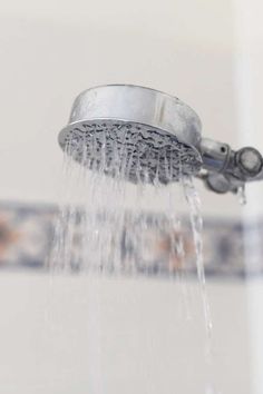 a shower head with water running from it