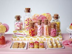 a table topped with lots of candy and candies