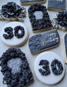 black and white decorated cookies with happy birthday written on them