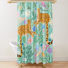 the shower curtain is decorated with an image of a cheetah and tropical flowers