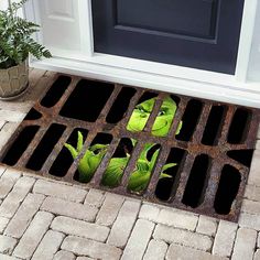 a door mat with plants growing out of it