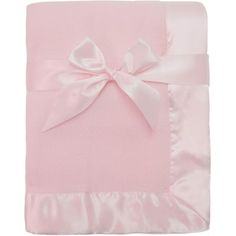 a pink blanket with a white bow on the front and back of it's cover